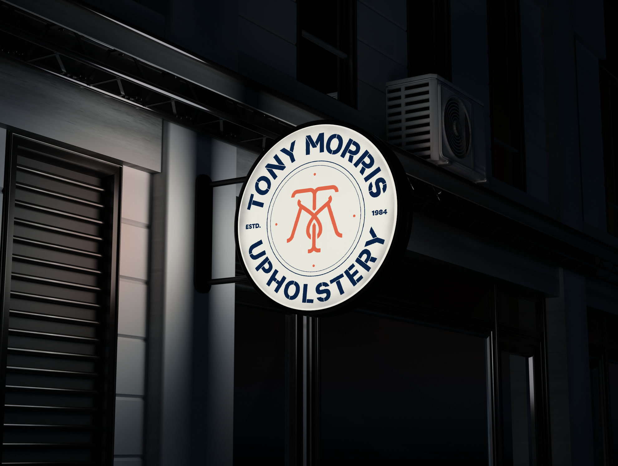 Tony Morris stamp sign mounted on the workshop front